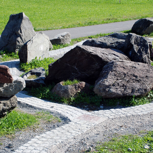 Walk along the stone path through 300 million years of Glarus!